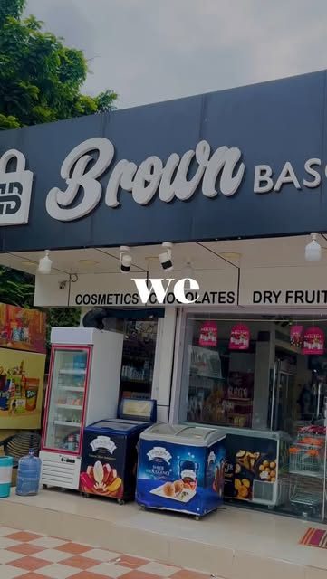 Brown Bascaed storefront with cosmetics, chocolates and dry fruits signage
